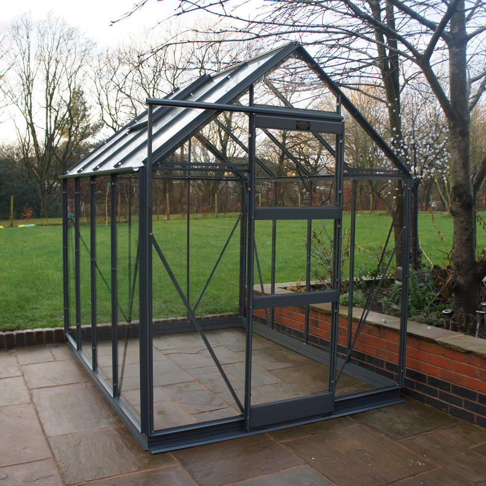 blue frame greenhouse in garden