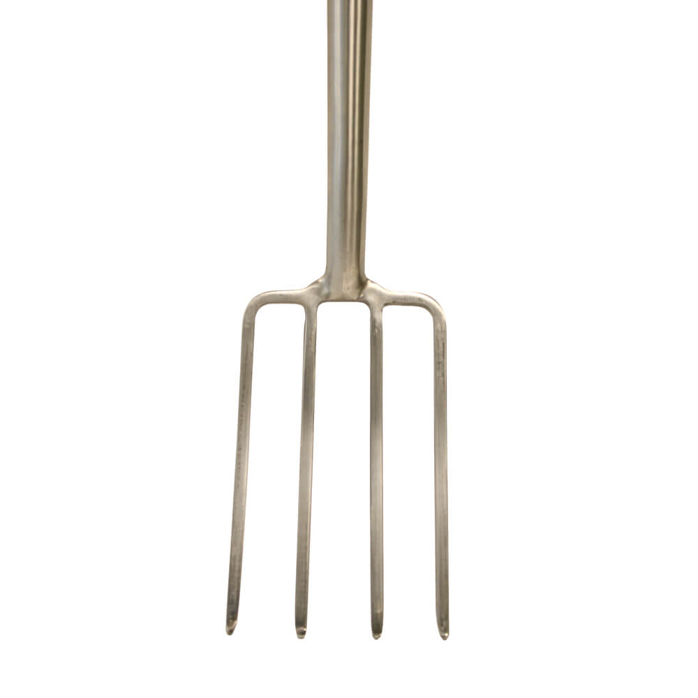 Metal garden fork on a white background