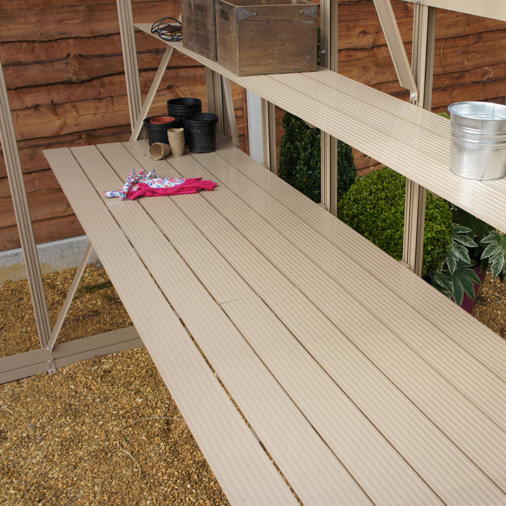greenhouse shelves with pots on