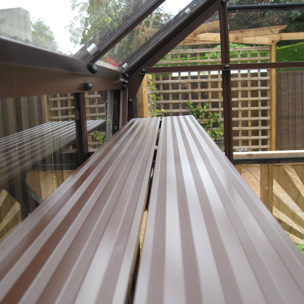 brown greenhouse shelves in garden