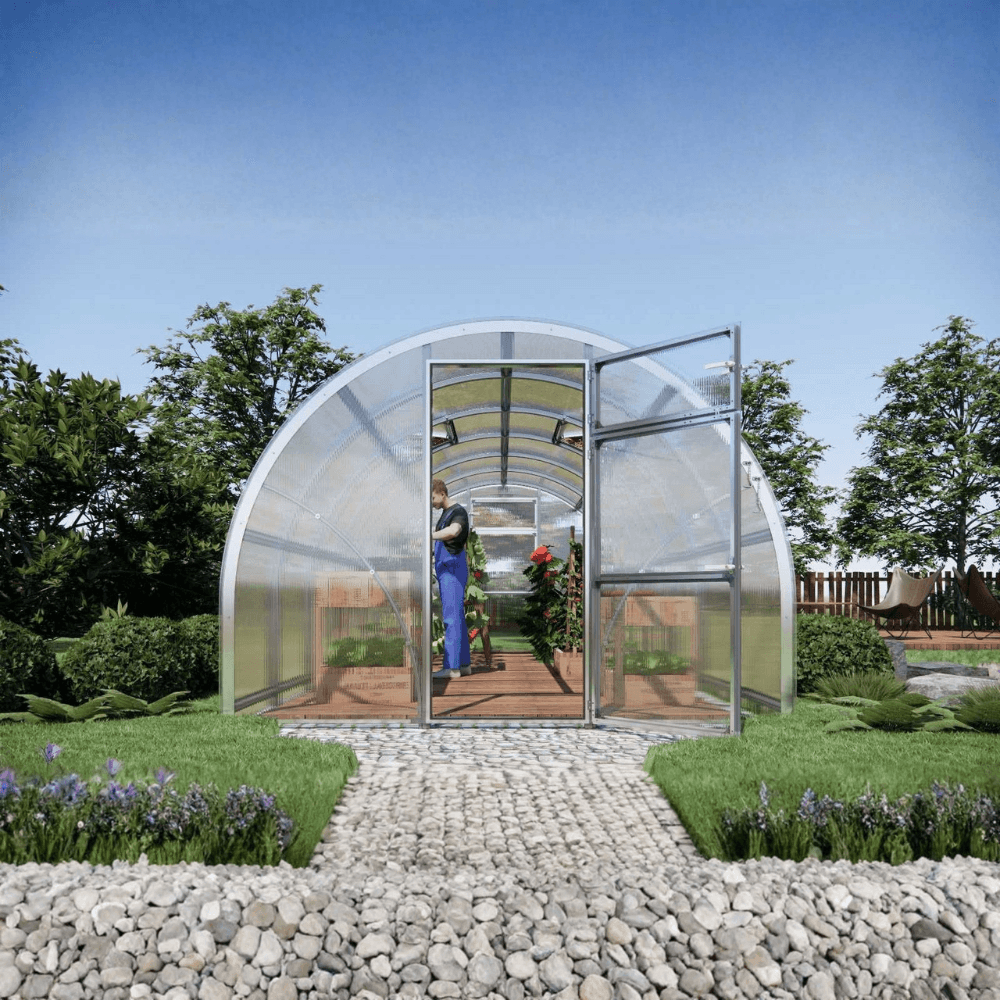 large polytunnel greenhouse with a person inside, surrounded by greenery and flowers.