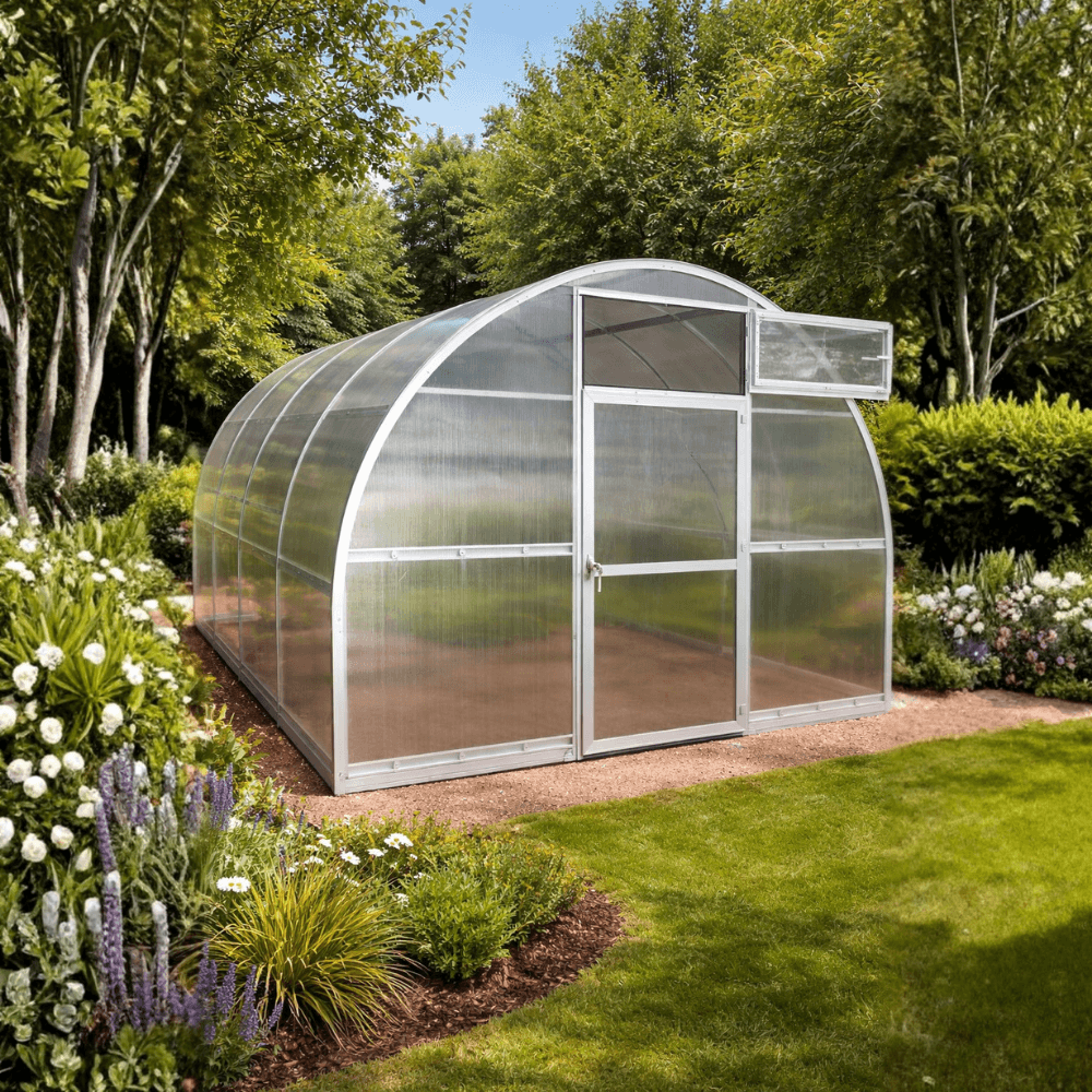 Clear greenhouse in a garden setting with trees and flowers