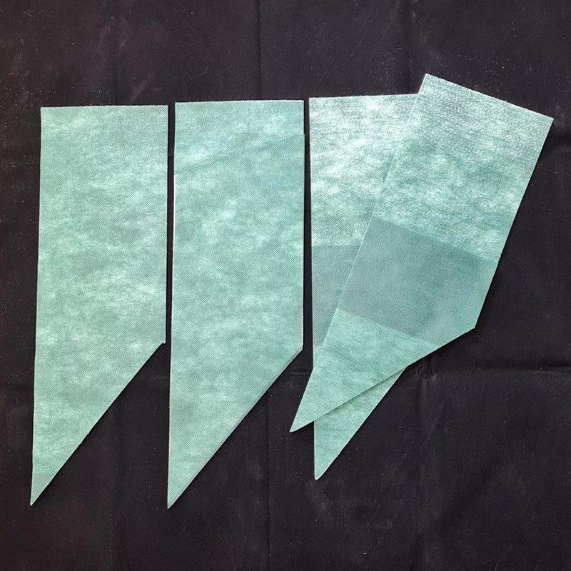 A set of four green, solid-colored capillary matting sheets designed to be used in Quadgrow planters for watering and moisture control.