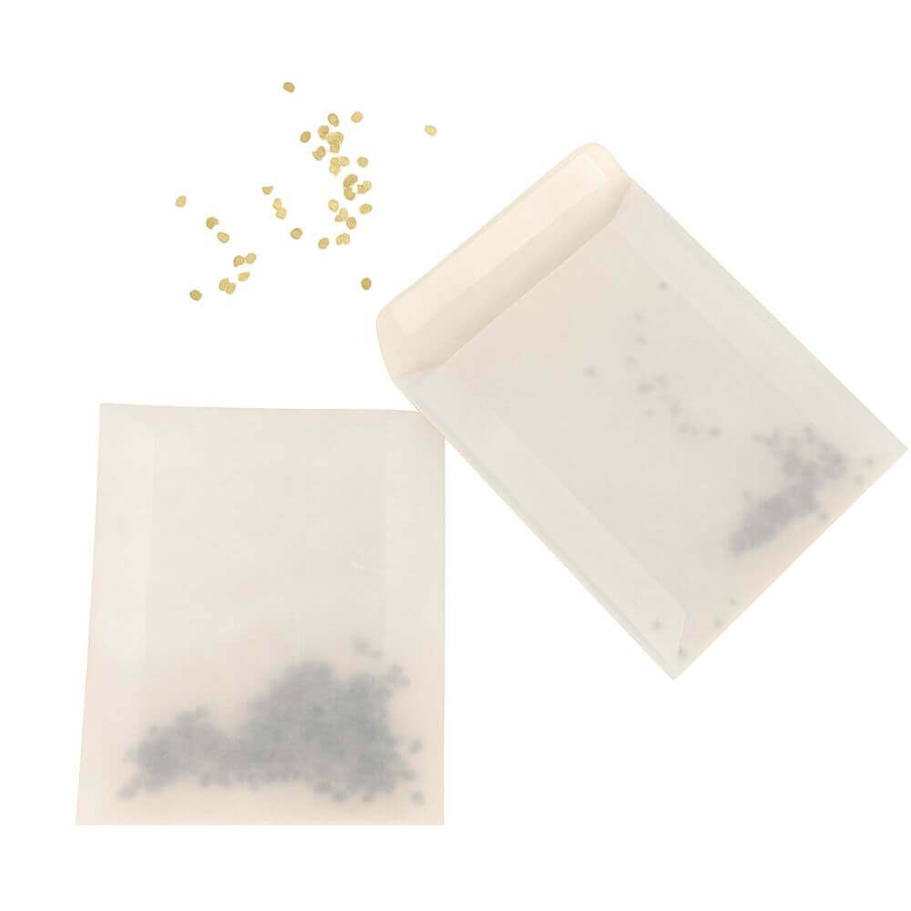 Seed envelopes and seeds on white background