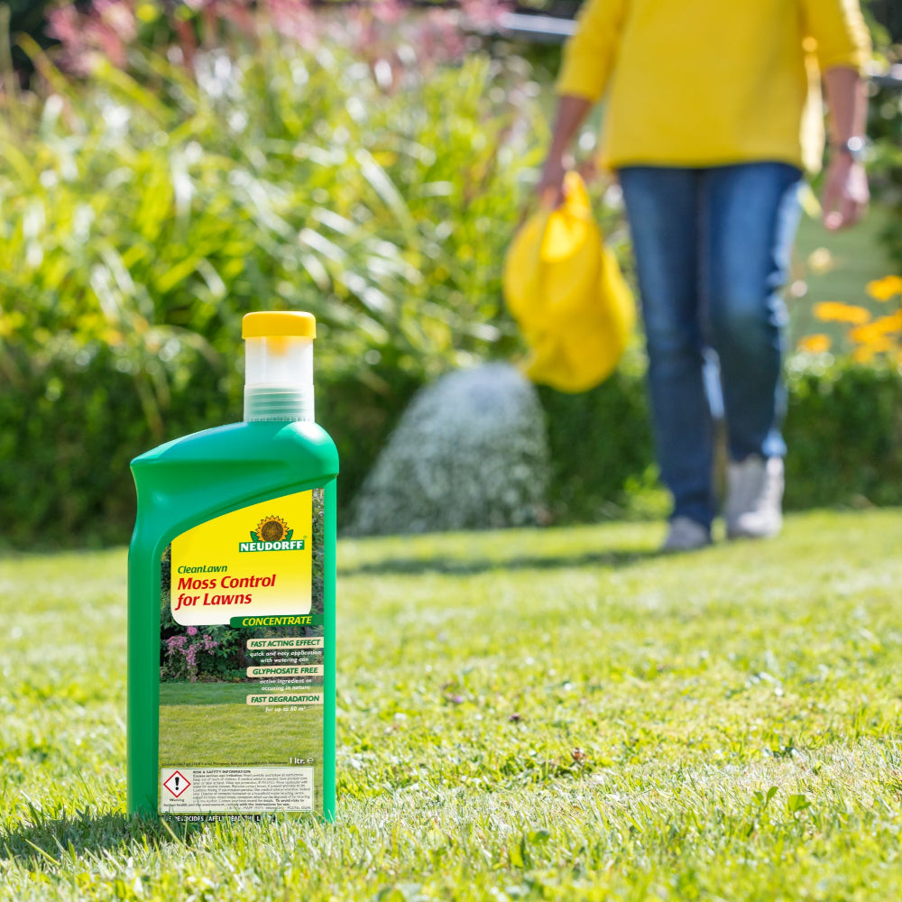 moss control for lawns being applied