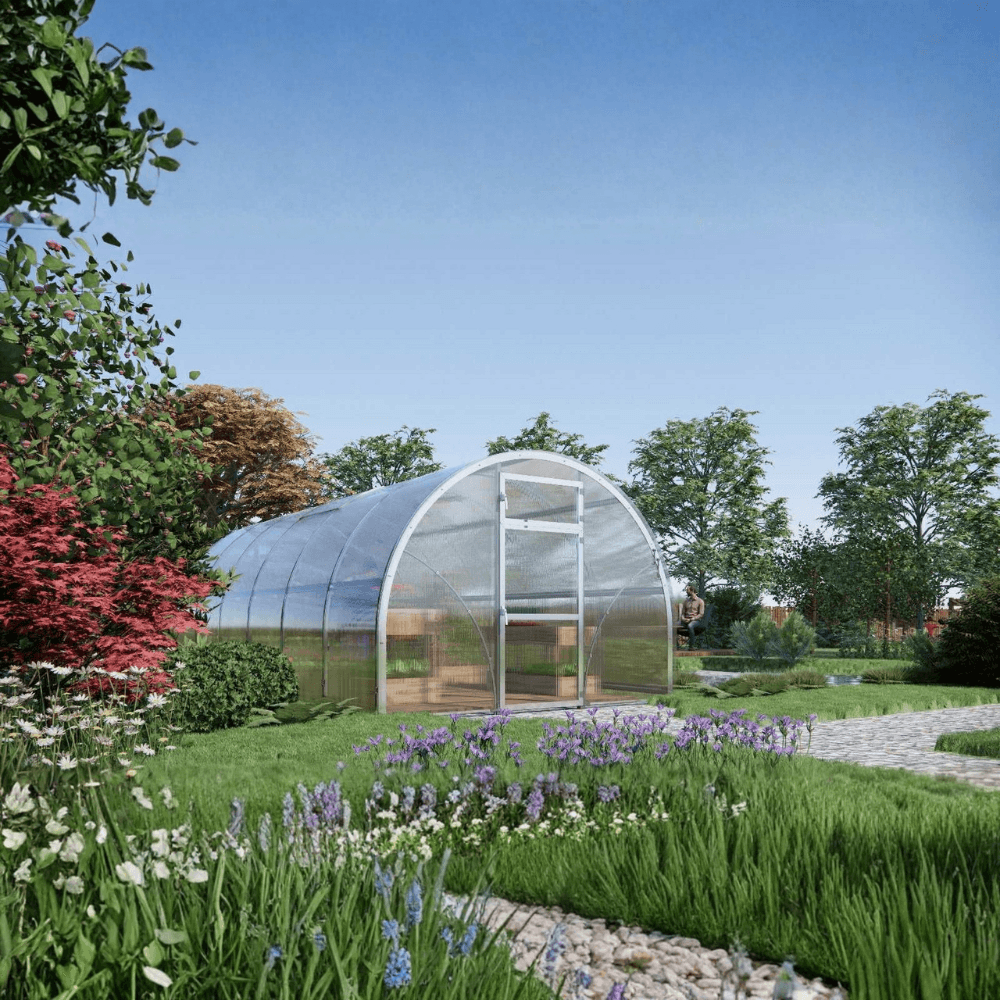 Garden with a big polytunnel greenhouse surrounded by greenery and flowers