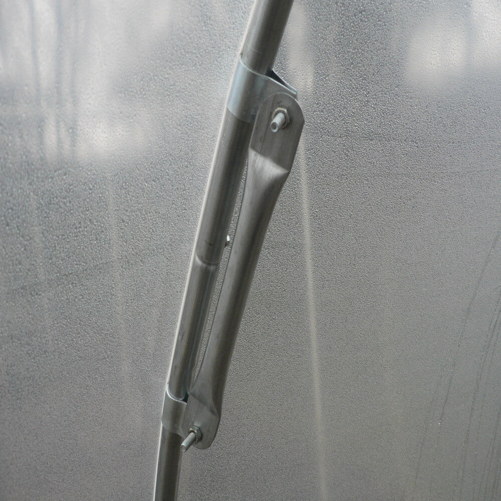 Close-up of a wiper blade on a vehicle window with a blurred background