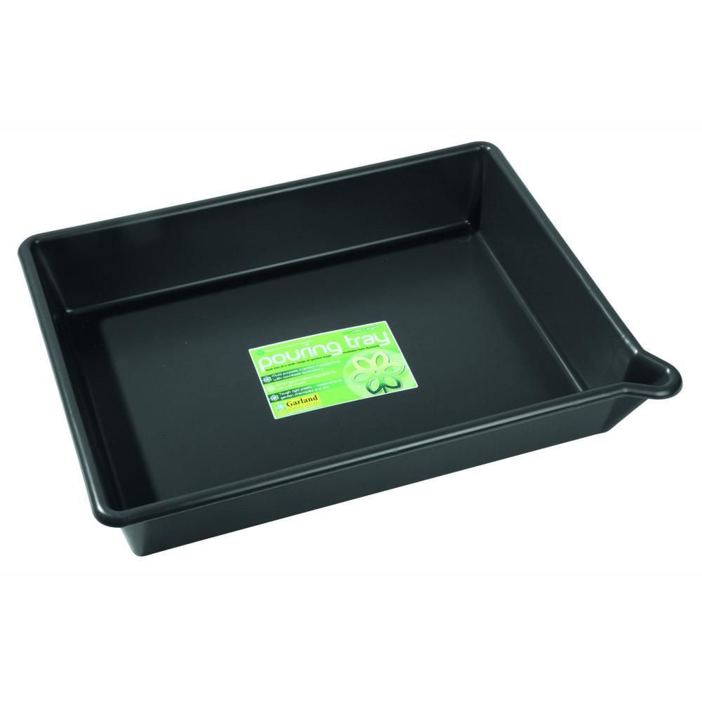 Black tray with a green label on a white background
