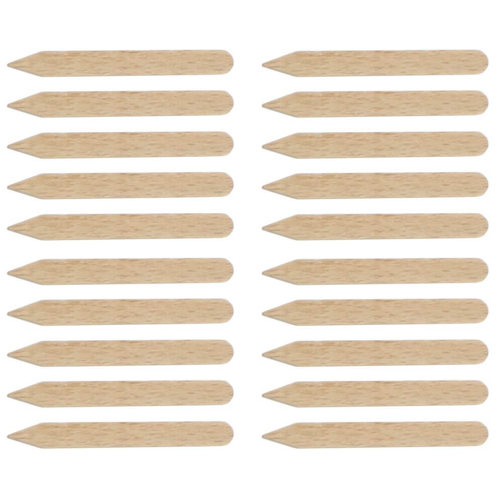 Multiple wooden plant labels arranged in rows on a white background